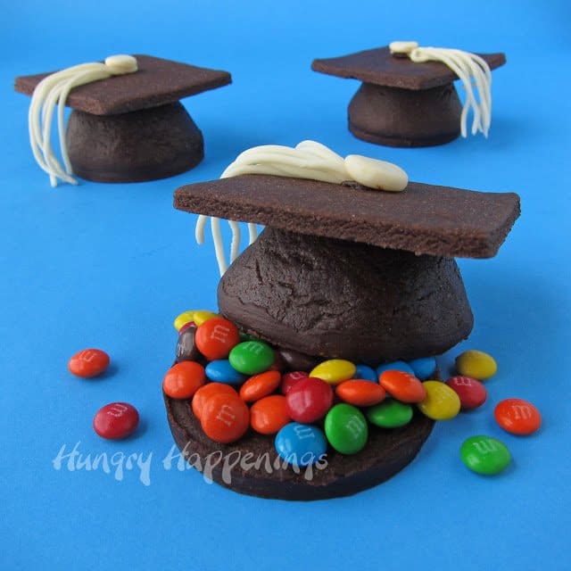 Graduation hat chocolates on a blue background