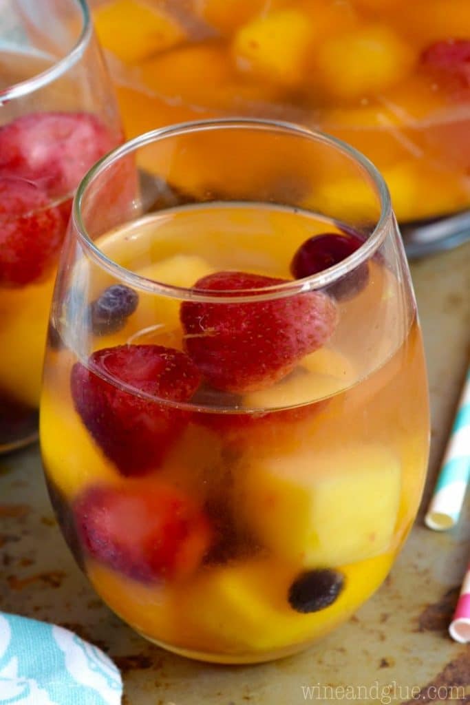 frozen fruit sangria close up with a straw on the side