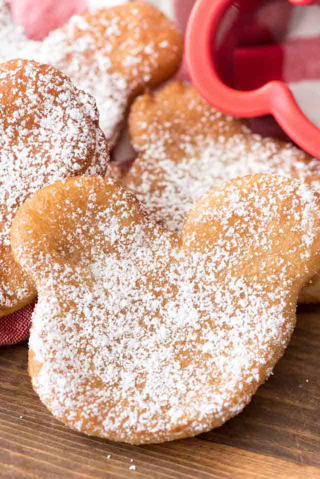 These EASY Beignets start with biscuit dough! They have only 3 ingredients and are the perfect copycat disneyland recipe!