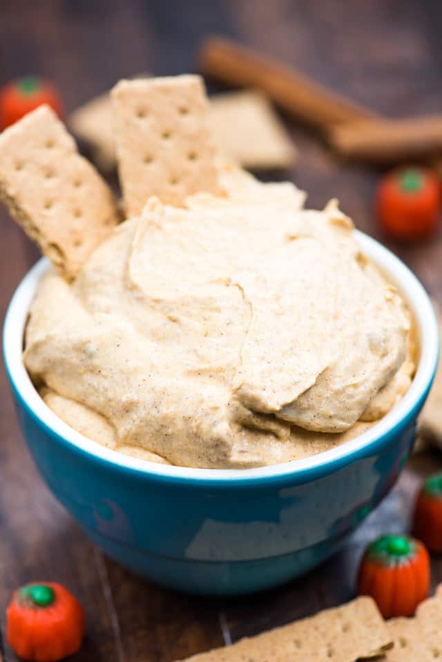  Pumpkin Fluff Dip in a blue bowl with graham crackers