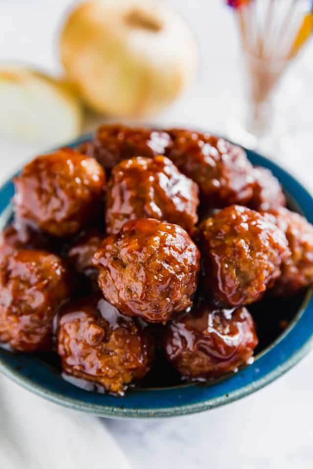 A Blue bowl containing BBQ Meatballs