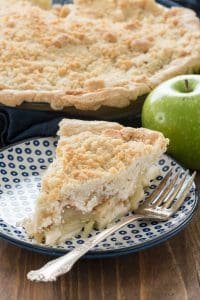 Crumb Apple Pie  on a blue and white plate with a fork