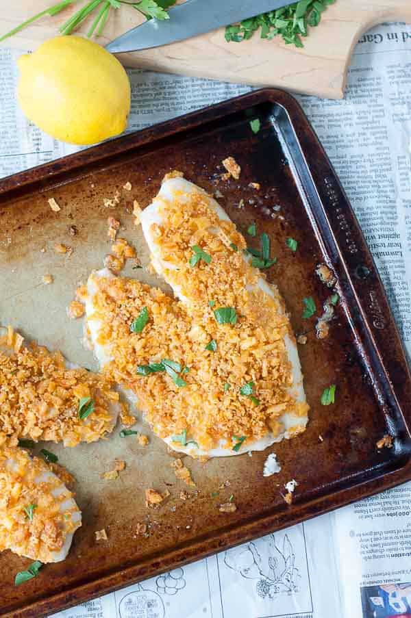 Potato Chip fish on a baking sheet on top of newspaper