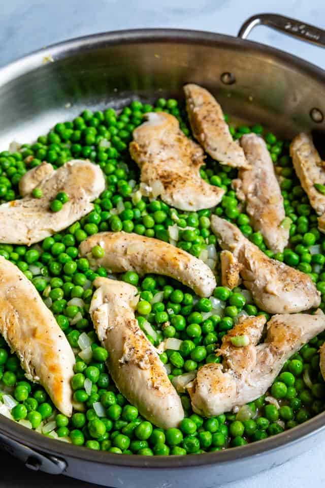 overhead shot of chicken and peas