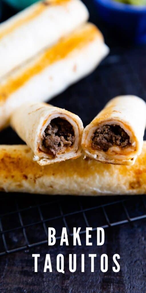 Close up shot of baked taquitos with one split in half so you can see the inside filling with recipe title on bottom of photo
