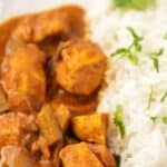 Close up shot of chicken curry and rice with colorblock and recipe title on top of photo