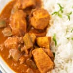 Closeup photo of chicken curry with rice in a bowl
