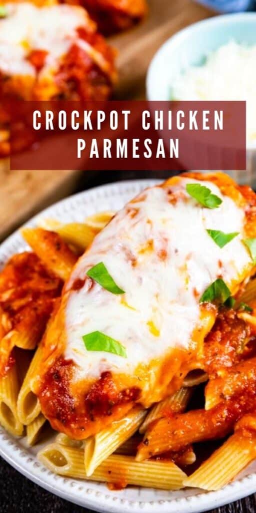 Crockpot chicken parmesan on top of penna pasta on a white plate with red color block and recipe title on top of image