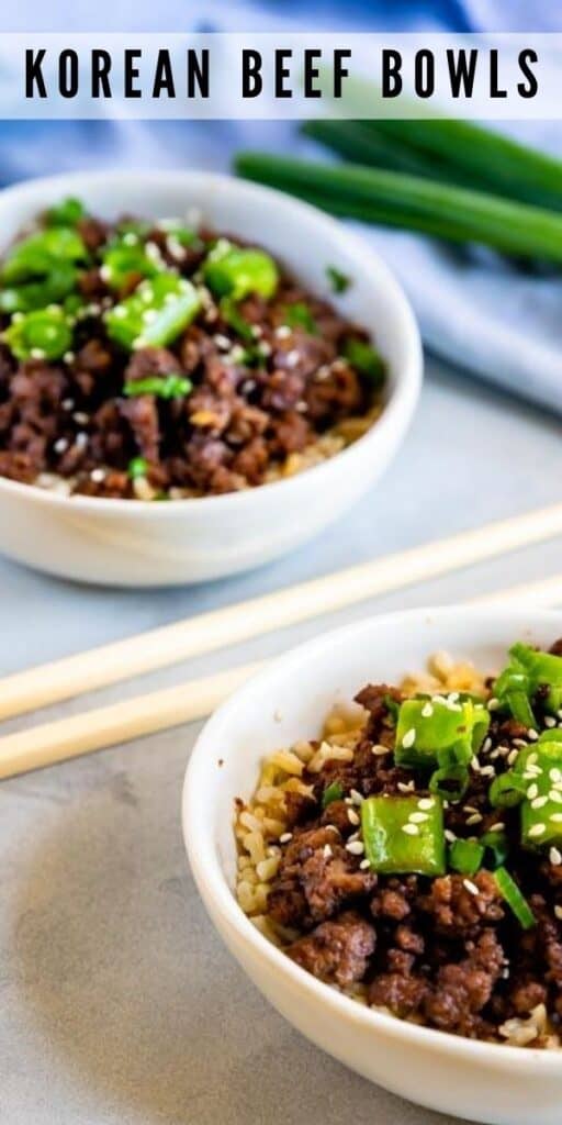 Korean beef bowls in white bowls with chopsticks in between with recipe title on top