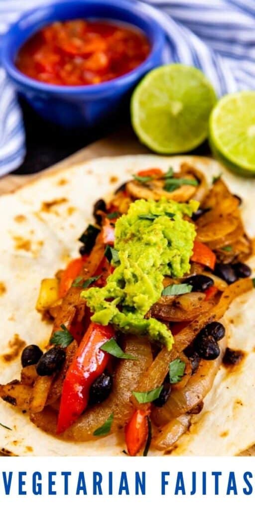 Vegetarian fajita with guacamole on top and salsa and limes in background and recipe title on bottom