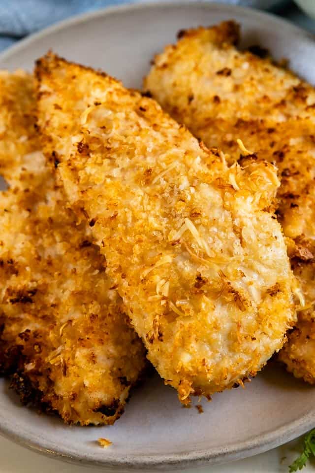 Close up of air fryer chicken tenders on a grey plate
