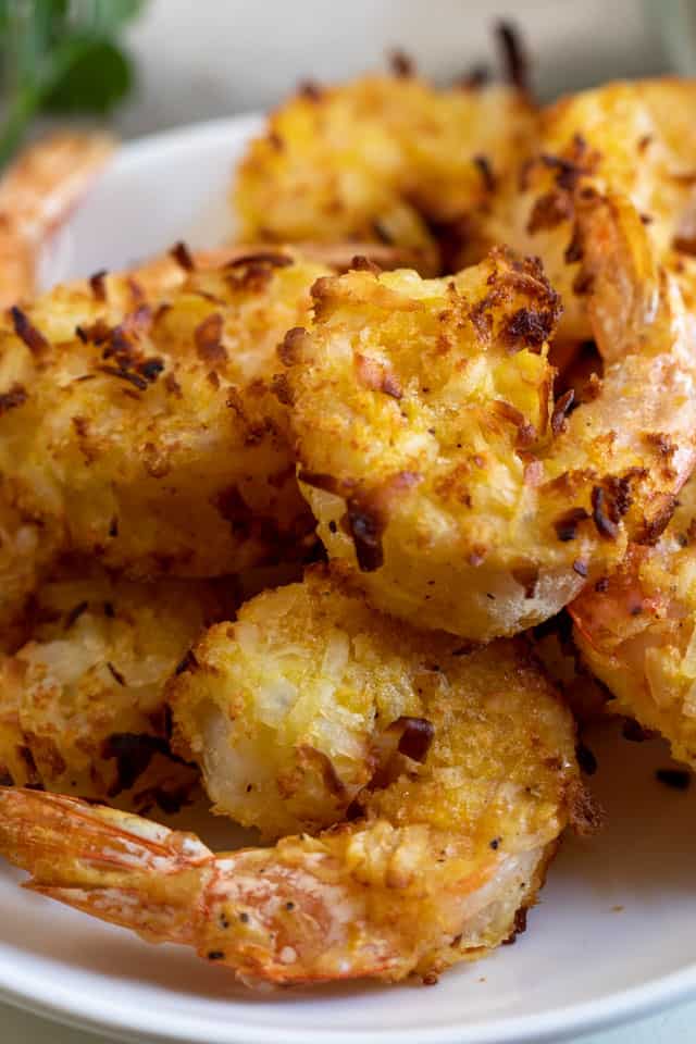 Close up of air fryer coconut shrimp on a white plate