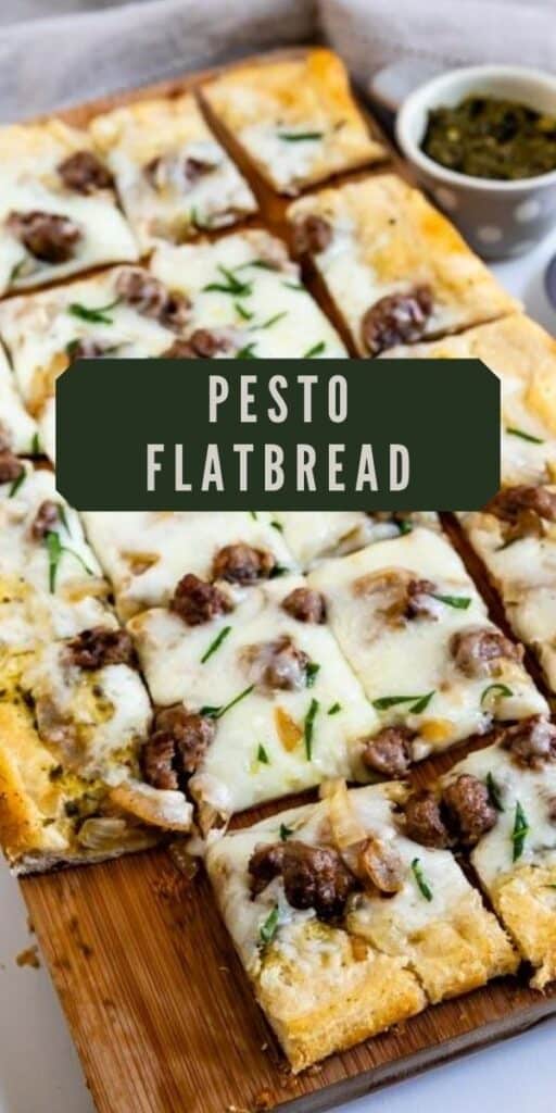 Overhead shot of pesto flatbread slice into squares on a wood cutting board with recipe title on top of image