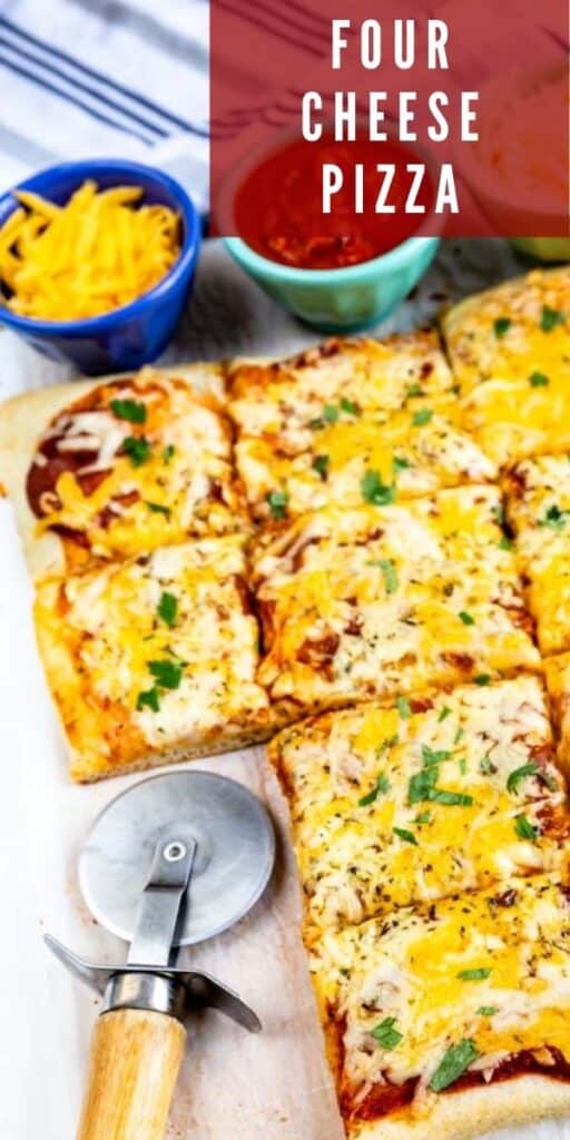 Four cheese pizza cut into squares with pizza cutter and cheese in background and recipe title on top of photo