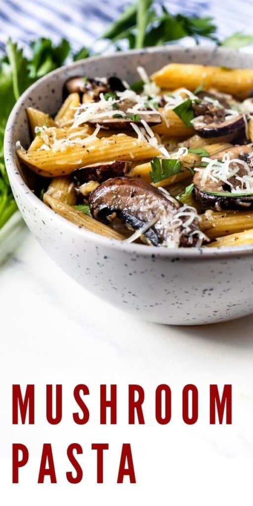 Close up side photo of mushroom pasta in a bowl with parmesan cheese on top and recipe title on bottom of photo