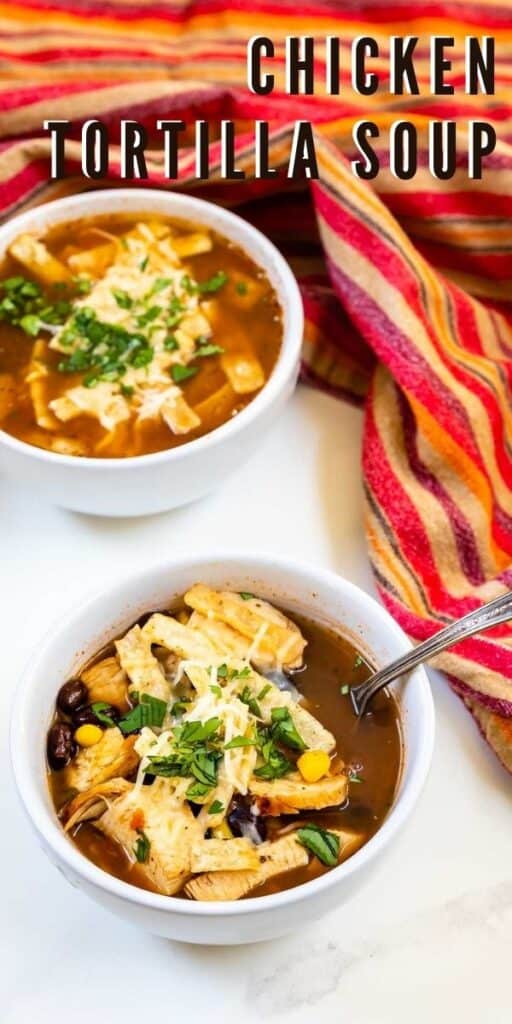 Overhead shot of two bowls of chicken tortilla soup with recipe title in upper right hand corner of photo