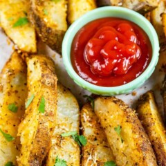 Overhead shot of potato wedges with ketchup