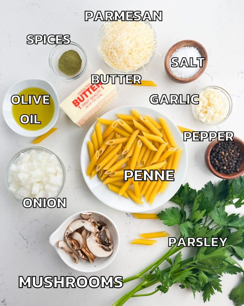 ingredients in mushroom pasta laid out on a white marble counter. 