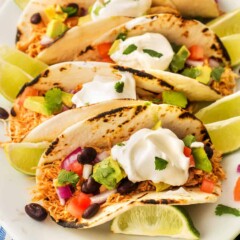 Overhead close up view of chicken street tacos loaded with toppings