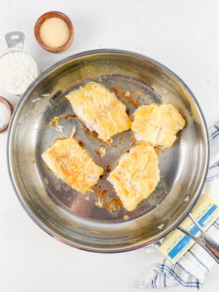 process shot of pan seared cod being made.