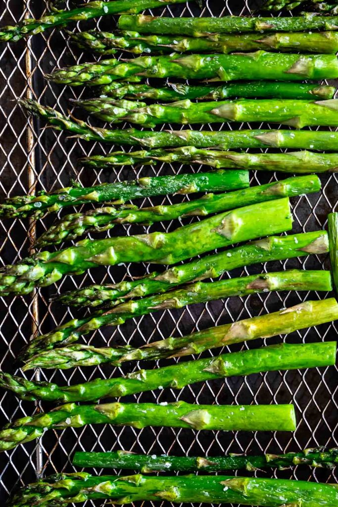 Overhead shot of asparagus on the air fryer rack