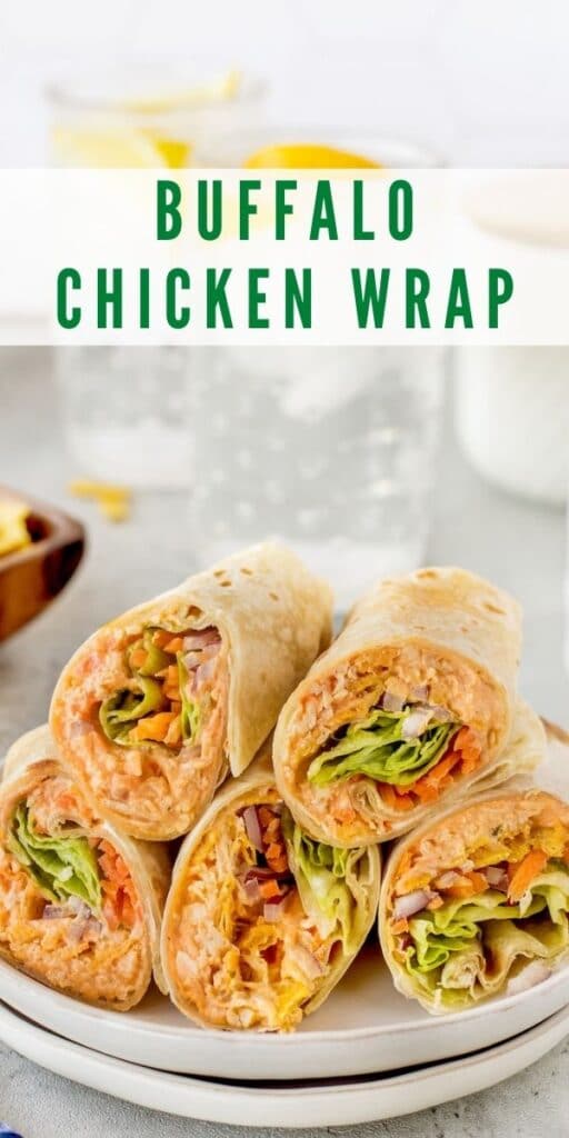 Buffalo chicken wraps cut in half and stacked on a plate with recipe title on top of image