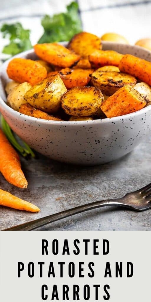 Bowl full of roasted potatoes and carrots with a fork in front of it and recipe title on the bottom of photo