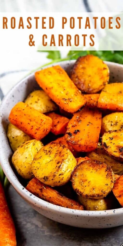 Close up shot of roasted potatoes and carrots with recipe title on top of image
