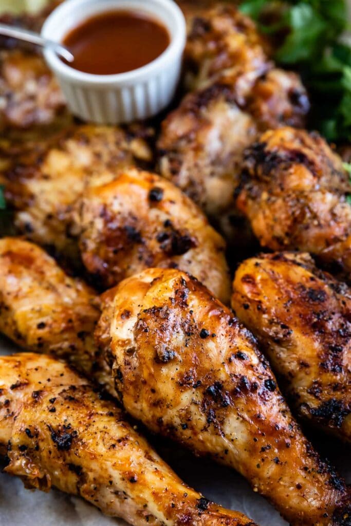 Close up shot of easy barbecue chicken with dipping sauce