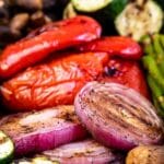 Close up shot of grilled vegetables with recipe title on the bottom of photo