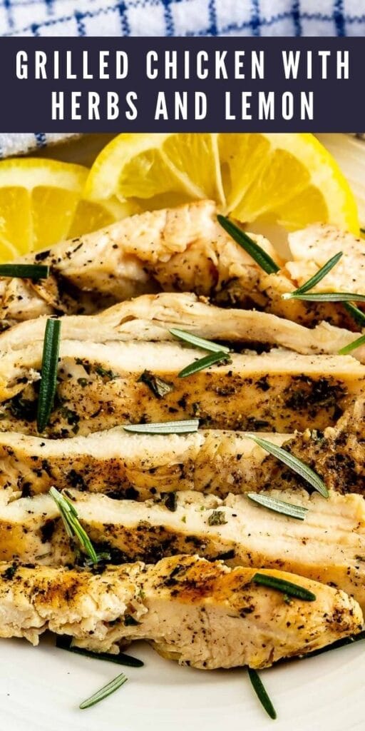 Close up shot of grilled chicken with herbs and lemon with recipe title on top of image