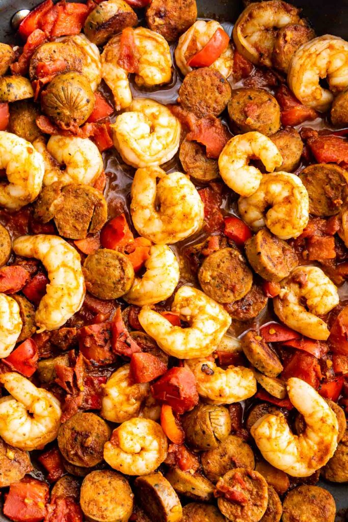 Overhead shot of spicy shrimp and sausage in skillet