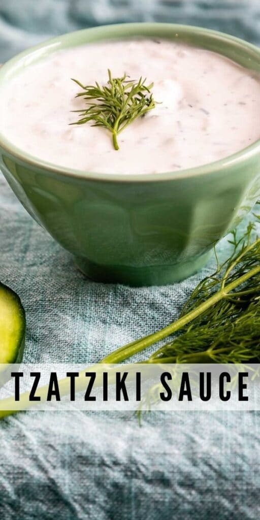 Tzatziki sauce with dill on top and ingredients and dippers around it and recipe title on bottom of photo