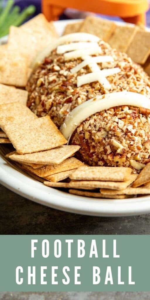 Football Cheese Ball on a serving plate surrounded by crackers with recipe title on bottom of photo