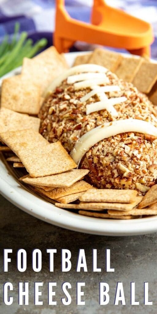 Football Cheese Ball on a serving plate surrounded by crackers with recipe title on bottom of photo