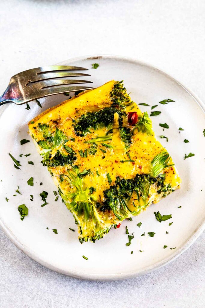 One square piece of broccoli breakfast casserole on plate