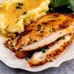 Plate with cajun turkey breast and mashed potatoes with recipe title on bottom of photo