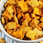 Overhead shot of chex mix in a bowl with recipe title on bottom of photo