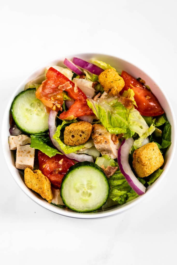 overhead shot of salad in bowl with croutons