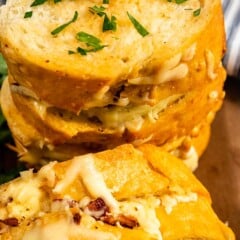 Close up shot of stack of turkey, bacon and cheese pull apart sandwiches