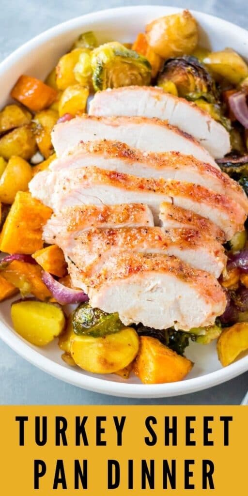 Overhead shot of sliced turkey on top of vegetables with recipe title on bottom of photo