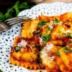 Easy ravioli bake on a plate with full dish in background and recipe title on bottom of photo