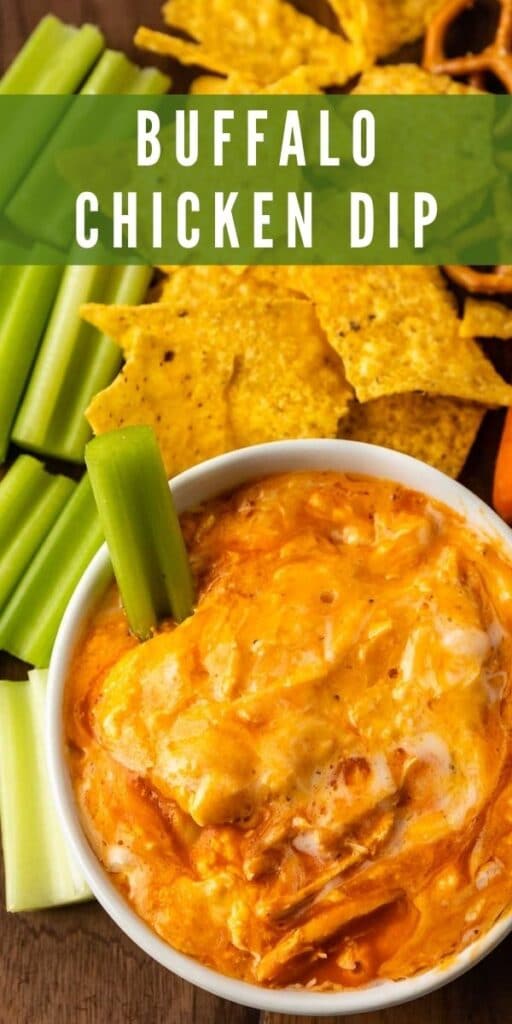 Overhead shot of buffalo chicken dip in a small bowl surrounded by chips, pretzels, carrots and celery with recipe title on top of image
