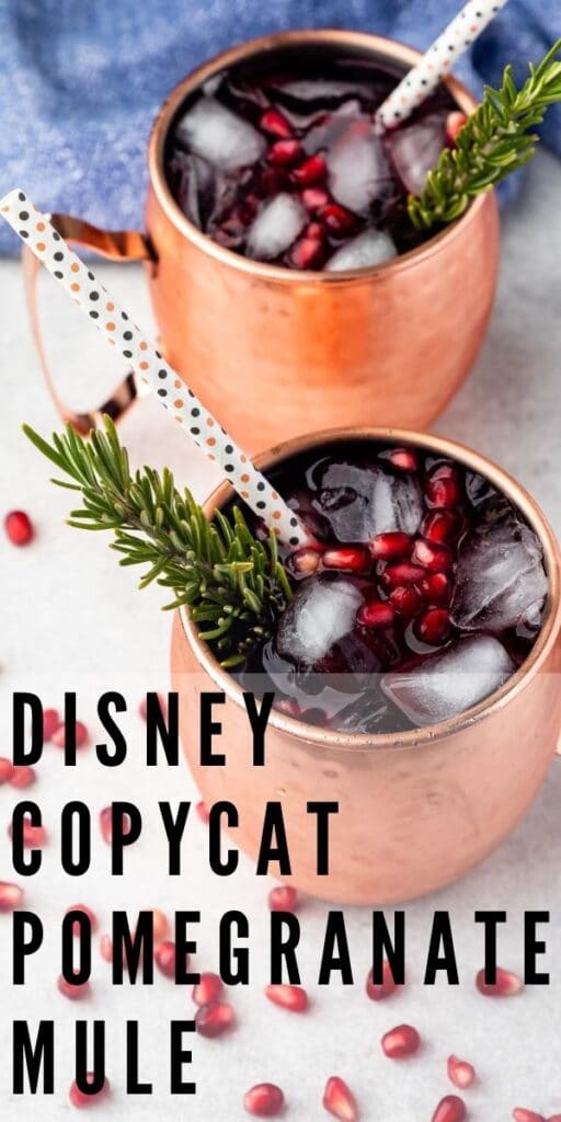 Two disney copycat pomegranate mule cocktails in copper mugs with recipe title on bottom of image