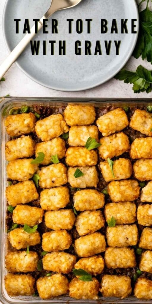 Overhead shot of tater tot bake in casserole dish next to plate and fork with recipe title on top of image