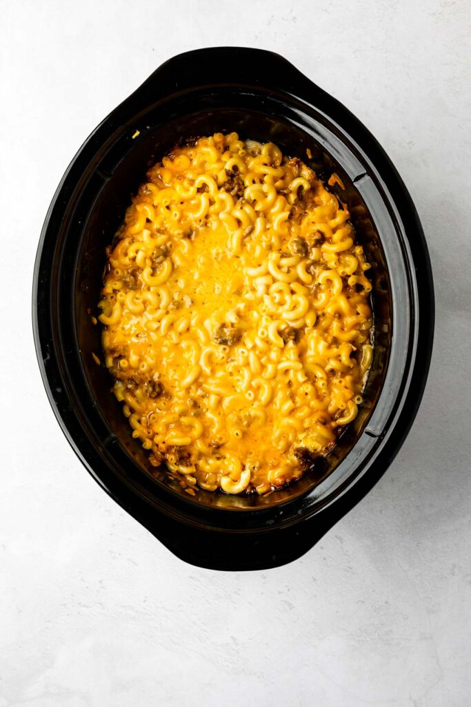 Overhead shot of mac n cheese with sausage in crockpot