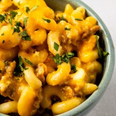 Close up overhead shot of crockpot mac n cheese with sausage