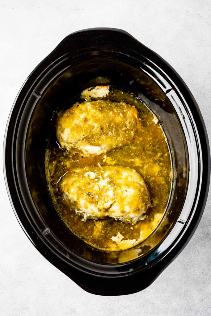 Overhead shot of chicken breast inside slow cooker