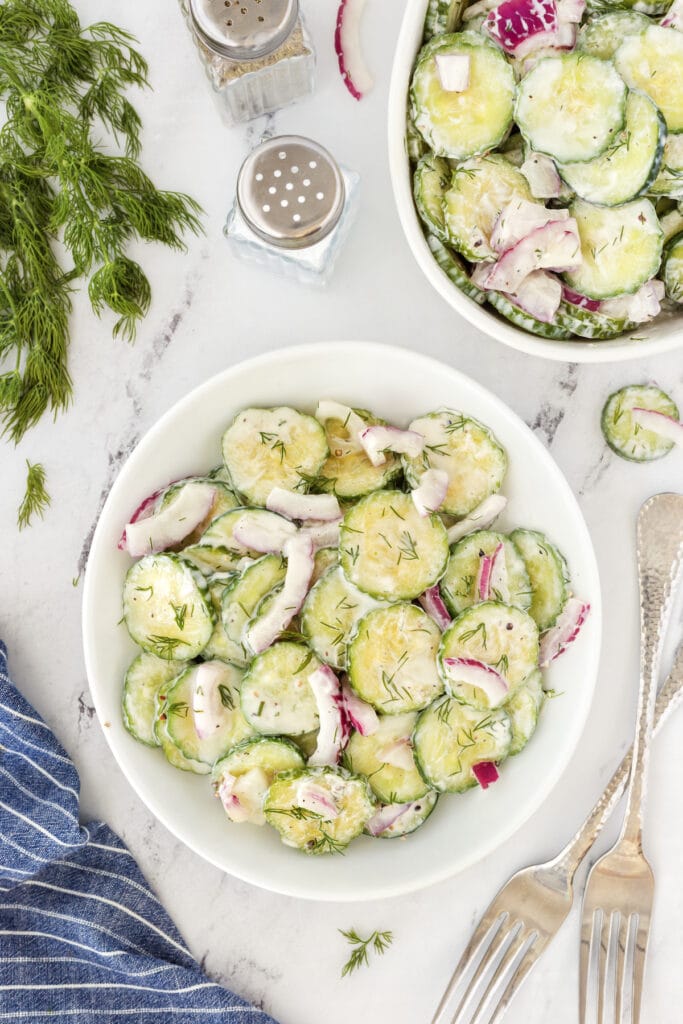 cucumber salad on white plate.