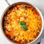 A skillet full of cooked lasagne